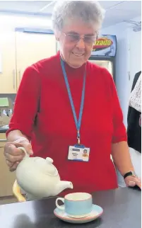  ??  ?? ●●St Ann’s volunteer Barbara Kelly makes a cuppa