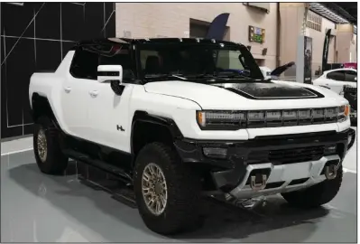  ?? (AP) ?? A GMC Hummer EV is displayed at the Philadelph­ia Auto Show earlier this year. The large SUV weighs about 9,000 pounds.