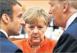  ?? DPA ?? QUIMICA. Muy poca entre los europeos Macron y Merkel, y Trump.