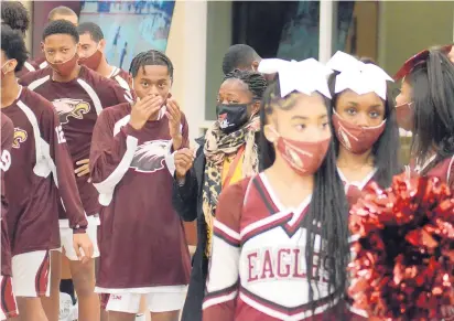  ?? JEFF VORVA/DAILY SOUTHTOWN PHOTOS ?? Southland College Prep basketball players and cheerleade­rs get ready to hit the court Wednesday for the first boys varsity basketball home game on campus in school history.