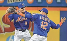  ?? ANDY MARLIN/USA TODAY SPORTS ?? Left fielder Brandon Nimmo and center fielder Juan Lagares enjoy the Mets’ victory Monday against the Nationals that ended a five-game losing streak.