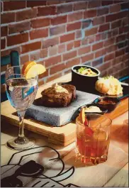  ?? ?? You will be able to cook your own steak on a 755° volcanic stone while enjoying tapas items and specialty cocktails at On The Rocks Tapas Bar in Downtown Shelby.
Photo Courtesy of On The Rocks Tapas Bar