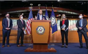  ?? (AP/Amanda Andrade-Rhoades) ?? Rep. Hakeem Jeffries of New York is joined by fellow Democratic House members at a news conference Tuesday on the $3.5 trillion budget blueprint passed by the House. The action sets in motion efforts to forge a fuller plan.