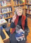  ??  ?? Paula Paul, pictured with lap dogs Allie, left, and Wolfie, has an unpublishe­d novel with her agent and another in the planning stages. A native of West Texas, Paul was in the third grade when she decided she wanted to write books.