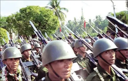  ?? VOJA M/AFP ?? Soldiers of the Myanmar Army march in the Armed Forces Day golden jubilee parade in Rangoon on March 27, 1995.