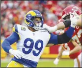  ?? Associated Press ?? Rams defensive tackle Aaron Donald (99) battles Kansas City Chiefs guard Nick Allegretti (73) during the first half on Sunday in Kansas City, Mo. Donald sprained his ankle in the game.