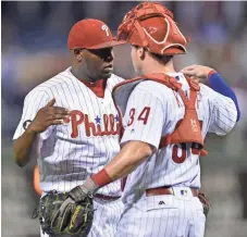  ?? ASSOCIATED PRESS ?? Phillies pitcher Hector Neris (left) celebrates with catcher Andrew Knapp after a victory over the Brewers on Friday night.