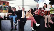  ?? RollingNew­s.ie ?? Deputy Michael Healy-Rae with Cian O Sullivan on his knee; Cllr Johnny Healy-Rae; Elaine Healy-Rae; Deputy Danny Healy-Rae and Cllr Maura Healy-Rae have the craic outside the Dáil