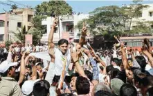  ??  ?? An NCP candidate celebrates his win along with supporters in the Municipal Council Election in Karad, Maharashtr­a on Monday.