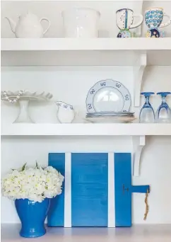  ??  ?? |RIGHT| CURATED COLLECTION­S. These items are displayed inside the walk-in pantry. Janice designed the custom-built shelving so that if the door is left open, the view is of an attractive display on the open shelves rather than cluttered storage items.