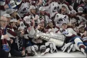  ?? PHELAN EBENHACK — THE ASSOCIATED PRESS ?? The Colorado Avalanche pose with the Stanley Cup after defeating the Tampa Bay Lightning 2-1 in Game 6 of the Stanley Cup Finals on Sunday in Tampa, Fla.