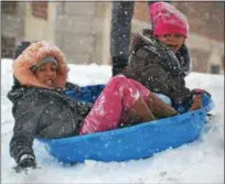  ?? PHOTO SUBMITTED BY KERRY KLINE ?? Several families took to the hill at Rupert Elementary School for some sledding Wednesday.