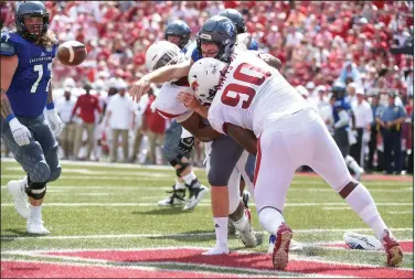  ?? Craven Whitlow/Special to the News-Times ?? Fumble: Arkansas' Armon Watts (90) strips the ball free during the Razorbacks' contest against Eastern Illinois last Saturday in Fayettevil­le. Arkansas hits the road to take on Colorado State Saturday.