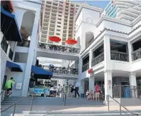  ?? CARLINE JEAN/SUN SENTINEL ?? The Gallery at Beach Place in Fort Lauderdale is for sale, but a representa­tive would not disclose the price. The outdoor mall opened in 1997 simply as “Beach Place.”