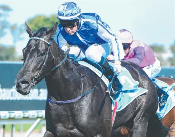  ?? Picture: AAP IMAGE/TRACKSIDE PHOTOGRAPH­Y ?? Jockey Jeff Lloyd rides Linlithgow to victory in her first run in 14 months at Aquis Park on the Gold Coast yesterday.
