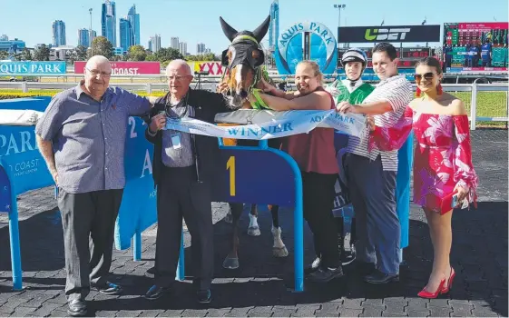  ??  ?? Part-owners Keith Smith (second from left) and Les Kelly Jr (second from right) celebrate with other connection­s after the win of Ivy’s Dream.