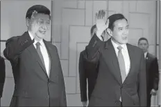  ?? JOSEPH NAIR, POOL/AP PHOTO ?? Chinese President Xi Jinping, left, and Taiwanese President Ma Yingjeou, wave to photograph­ers as they enter the room at the Shangri-la Hotel before their meeting on Saturday in Singapore. The two leaders shook hands at the start of a historic meeting...