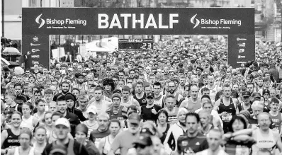  ?? AP ?? Runners at the start of the race during the Bath Half Marathon in Bath, England, Sunday, March 15, 2020. Despite coronaviru­s concerns, the half marathon has not been cancelled. For most people, the new coronaviru­s causes only mild or moderate symptoms. For some it can cause more severe illness, especially in older adults and people with existing health problems.