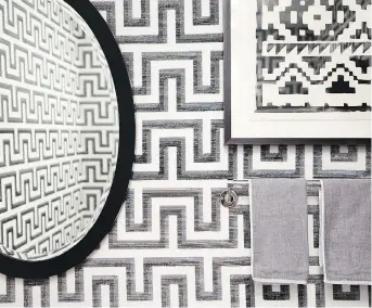  ?? DAVID NIX ?? A powder room designed by Briana Nix with Phillip Jeffries’ It’s Greek to Me wallpaper.