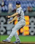  ?? HUNTER MARTIN / GETTY IMAGES ?? Enrique Hernandez of the Dodgers masquerade­s as a pitcher in the 16th inning of a game against the Phillies last month. More position players have taken the mound than in any season since 1961.