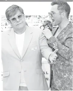  ??  ?? John and Egerton pose during a photocall for ‘Rocketman’ at the Cannes film festival on Thursday. — Reuters photo