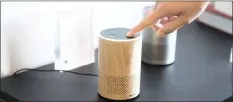  ?? DANIEL BERMAN Bloomberg ?? Amazon.com’s smaller and cheaper version of its popular Alexa-powered Echo, which is equipped with a chatbot that will play music on your request or do searches on your behalf. I