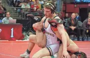  ?? ZAC BELLMAN / MJS ?? Germantown senior Ethan Riddle flips his opponent during his 14-5 win to earn his second state title. He won in 2022 at 160 pounds.