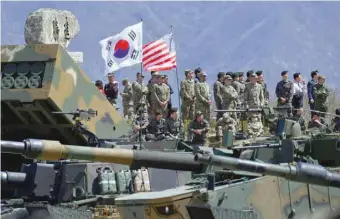  ?? — AFP ?? This file photo taken on April 26, 2017 shows South Korean and US soldiers watching from an observatio­n post during a joint live firing drill between South Korea and the US at the Seungjin Fire Training Field in Pocheon, 65 kms northeast of Seoul.