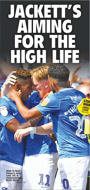  ?? PICTURE: TGS ?? HEAD TO HEAD: Pompey’s Jamal Lowe, left, is congratula­ted by Ronan Curtis