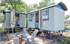  ??  ?? i Shed and bed: two shepherd huts offer sea views at the Pig on the Beach in Dorset ii Dining on the terrace by the pool at Nare Hotel’s Quarterdec­k restaurant