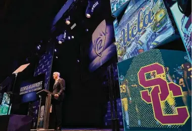  ?? Photos by Damian Dovarganes/Associated Press ?? Pac-12 commission­er George Kliavkoff tried to paint a positive picture of the league’s future after the defections of UCLA and USC to the Big Ten during the conference’s media days.