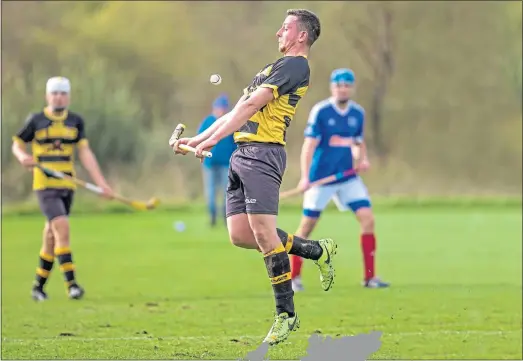  ??  ?? Hamish Harrison playing shinty for his beloved Col-Glen after the weekly 253-mile journey