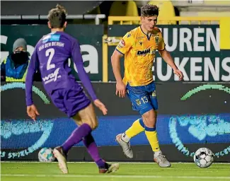  ?? GETTY IMAGES ?? Liberato Cacace, right, has been a regular starter for Belgian Pro League club Sint-Truiden after making the move to Europe.