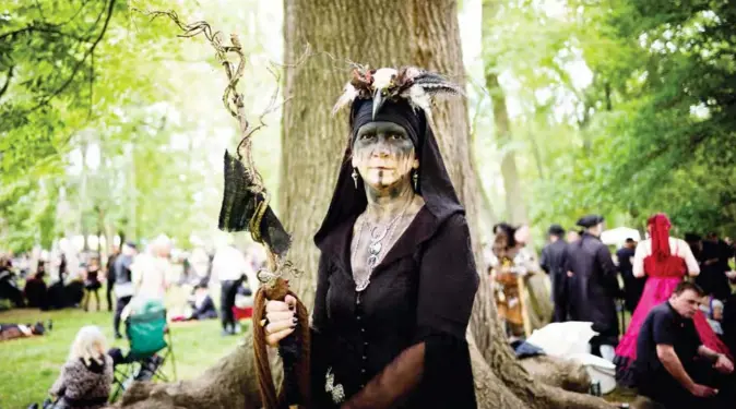  ??  ?? A participan­t of the Wave-Gothic-Festival poses for a photo at the Victorian picnic on June 7, 2019 in Leipzig, eastern Germany. The yearly music and culture festival of the black gothic scene, that traditiona­lly takes place over the Pentecost holidays, will run from June 7 to 10, 2019. — AFP