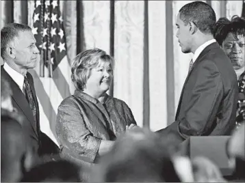  ?? MANUEL BALCE CENETA/AP 2009 ?? President Barack Obama greets the parents of Matthew Shepard, Dennis and Judy, during a reception commemorat­ing the Matthew Shepard and James Byrd Jr. Hate Crimes Act.
