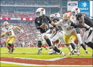  ?? Ralph Freso
The Associated Press ?? Cardinals quarterbac­k Kyler Murray eludes the reach of 49ers defensive end Arik Armstead during the second half of Sunday’s game in Glendale, Ariz.