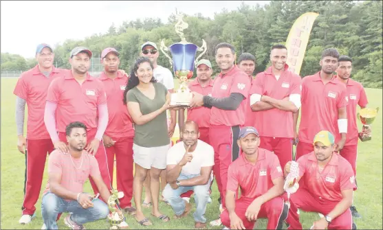  ??  ?? SVC Mafia’s captain Anil Beharry collects the winning Open trophy from Emma Sunich, daughter of Ramesh Sunich, proprietor of Trophy Stall.