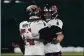  ?? PRESS ?? MORRY GASH — THE ASSOCIATED
Tampa Bay Buccaneers quarterbac­k Tom Brady
(12) celebrates with Ali Marpet after winning the NFC championsh­ip game in Green Bay, Wis., on Sunday.