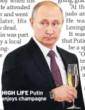  ??  ?? HIGH LIFE Putin enjoys champagne