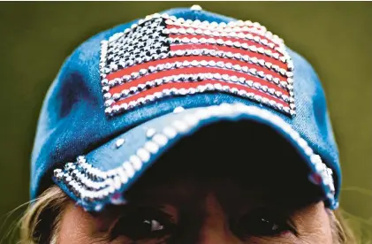  ?? GROUP SCOTT SERIO/BALTIMORE SUN MEDIA ?? An American flag cap provoked loud reactions of disdain from a columnist’s children, who associated it with the Republican Party and former President Donald Trump. The flag should represent all Americans, regardless of their political views, says the children’s mother.