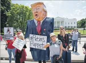  ?? AP PHOTO ?? Demonstrat­ors gather outside the White House Wednesday, a day after U.S. President Donald Trump fired FBI Director James Comey.