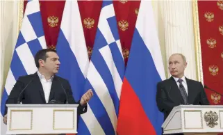  ??  ?? Russian President Vladimir Putin (r) looks on as Greek Prime Minister Alexis Tsipras addresses reporters in Moscow yesterday. The pair discussed cooperatio­n in energy and tourism and said a diplomatic spat this summer was over.