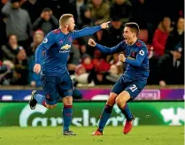  ?? ANDREW BOYERS/REUTERS ?? Wayne Rooney celebrates breaking the goal-scoring record for Manchester United last month.