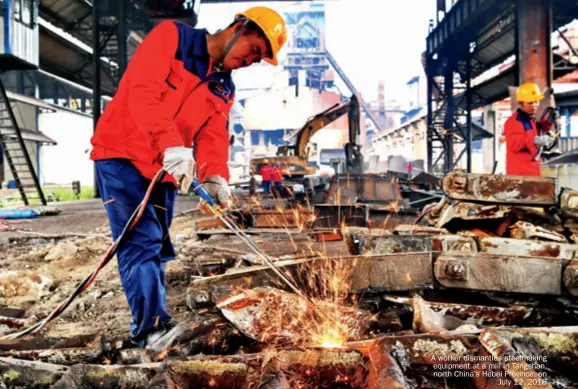  ??  ?? A worker dismantles steelmakin­g equipment at a mill in Tangshan, north China’s Hebei Province, on July 12, 2018