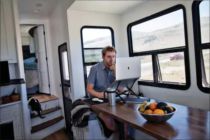  ?? Photo for The Washington Post by Kim Raff ?? Kevin Holesh works in the RV where he and his wife live full-time as they travel the country. An app he created several years ago helps people pull away from constant social media use.