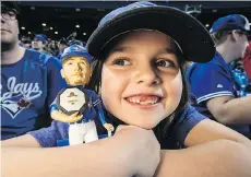  ?? CRAIG ROBERTSON ?? Harper Duffy, 10, was one of the lucky Toronto Blue Jays fans to get a Josh Donaldson bobblehead on Sunday in Toronto.