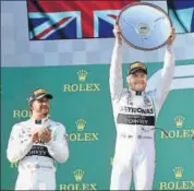  ?? REUTERS ?? Valtteri Bottas (right) holds the winner’s trophy on Sunday.