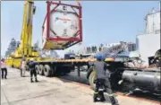  ??  ?? Navy personnel unload liquid medical oxygen tanks supplied by French company as Covid relief to India, in Mumbai on May 10.