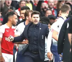  ??  ?? Tottenham manager Mauricio Pochettino reacts as players clash following Tottenham’s first goal. — Reuters photo