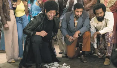  ?? Ron Tom / ABC ?? Laurence Fishburne (left) is seen in a flashback on “Black-ish,” the TV series on which he plays Pops.